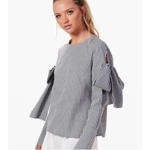 Black white pique blouse with fun sleeve ties